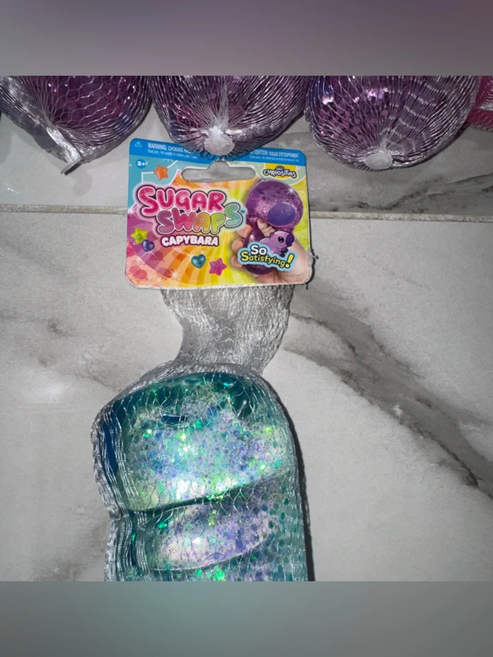Sugar swaps Glitter Squishes capybaras  - Blue, Purple & Pink Sensory Toy
